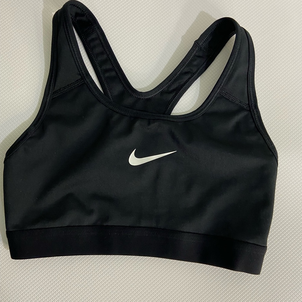 Nike swoosh black & white woman sports bra. Size XS. Great used condition.